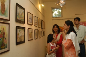 Visitors looking at the artworks at Artfest 09, Indiaart Gallery